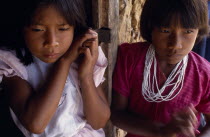 Two young Macuna Indian girls  one wearing highly prized white beads as necklace.