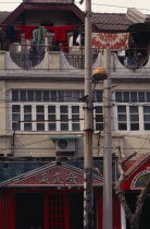 Detail of Colonial architecture with washing hung out to dry on upper balcony.