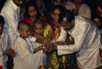 Young boy at his Upanayana Brahmin thread ceremony.