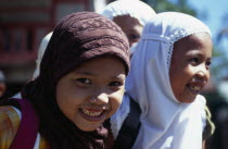 Indonesia, Aceh Province, Group of young Moslem girls with headscarves and smiling.