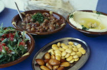 Mezze and table setting in seaside restaurant.