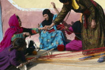 Bedouin women spinning and weaving.