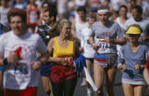 Elderly male and female amateur entrants running