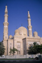 Jumeirah Mosque. Domed building with scattered trees.