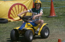 Young boy on quad bike