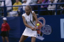 Anna Kournikova at Wimbledon 2000  about to hit a ball
