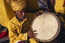 Drummer dressed in yellow