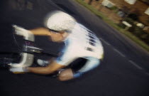 Cycle rider on racing bicycle in motion blur