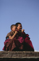 Young monks watching Tibetan festival.