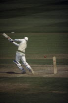 Pakistan Cricket Tour. Batter with ball traveling past him towards stumps