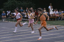 Children competing in relay race.