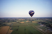 Single hot air balloon over Hedcorn and Kent countryside.
