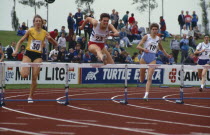 Female athletes during hurdles event