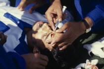 Hockey player receiving treatment during game betweeen India v England