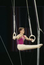 Gymnast Andreas Wecker competing on the rings.