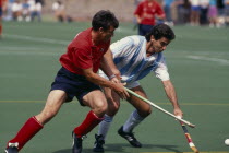 Two players from each team during a match between England and Argentina at Bisham Abbey