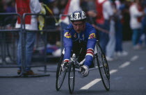 Disabled competitor in a racing wheelchair during the London Marathon.