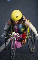 Disabled competitor in a racing wheelchair during the London Marathon.