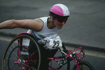 Disabled competitor in a racing wheelchair during the London Marathon.