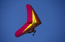 View looking up at hang glider in the sky.