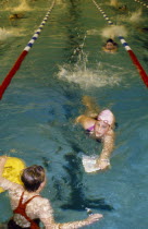 Girls in pool during club swimming practice.