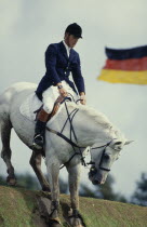 Horse and rider on grassy mound at Hickstead Derby