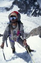 Pakistan.  Porter climbing to camp 1 on K2.
