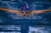 Male swimmer doing butterfly stroke