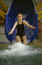 Girl sliding down water slide
