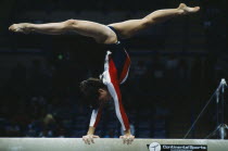 Female gymnast on the beam exercise during the World Student Games in Sheffield England