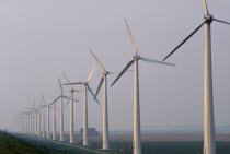 Wind generators in a line in a misty landscapeNetherlands Benelux Dutch Holland Nederland Western Europe