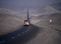 Traffic on Pan-American highway through coastal desert.