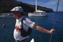 Tourist taking catamaran tour.Caribbean Holidaymakers Sightseeing Tourism Tourists West Indies Windward Islands