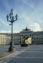 Winter Palace. Uniformed soldiers gathered in the courtyard with lampost in the foreground and archway behindEastern Europe Europe & Asia Rossija Rossiya Russian