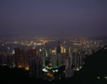 Elevated view over the harbour illuminated at night with skyscrapers and the Bank of China