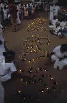 Lighting lamps during Wessac.Asia Asian Llankai Religion Religious Sri Lankan Wesak Wessak Vesak