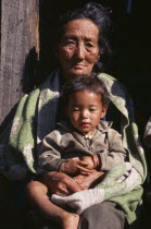 Woman holding child in her lap  head and shoulders portrait.Asia Asian Bharat Children Female Women Girl Lady Inde Indian Intiya Kids