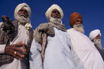 Elderly Sikh men  three-quarter view seen from below looking up.Asia Asian Bharat Inde Indian Intiya Male Man Guy Old Senior Aged Religion Religion Religious Sihism Sikhs