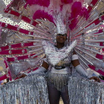 Performer in pink and silver costume.Caribbean One individual Solo Lone Solitary Trini Trinidadian West Indies