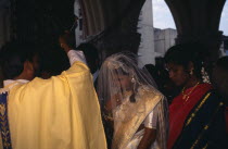 Christian wedding ceremony  bride and groom receiving blessing from priest.Asia Asian Bharat Inde Indian Intiya Marriage Religion Religion Religious Christianity Christians