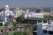 Golden Temple complex and surrounding city buildings.Asia Asian Bharat Inde Indian Intiya Religion Religious
