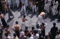 Mohurrum Shia muslim festival commemorating death of Husayn ibn Ali  grandson of Muhammad.  Boys beating themselves with chains in ceremonial mourning. Muharram  Mohurram  Asia Asian Islam Kids Mosle...