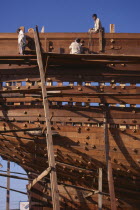 Shipbuilding.  Men at work on boat Asia Asian Bharat Inde Indian Intiya Male Man Guy