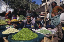 Vegetable market vendor selling fresh beans and peas.Asia Asian Bharat Inde Indian Intiya