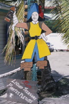 Redcliffe Quay.  Cut out pirate figure and sign advertising rum.Caribbean West Indies