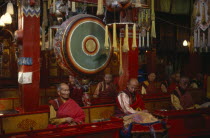 Gandantegchinlen monastery interior with Mongolian Buddhist monks.