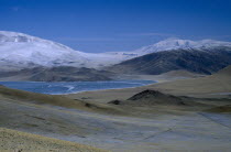 Partially frozen lake by Deluun on the Steppes
