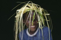 Foueda Island.  Portrait of Lau boy dressed for wedding celebrations.