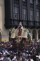 Traditional May 1st Festival with effigy of Virgen de Chapi being carried above the crowds