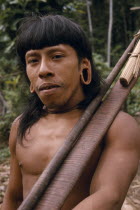Waorani Indian hunter with blow gun.
